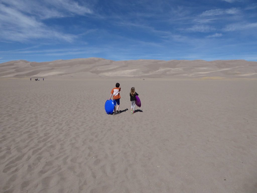 Sand Sledding at Great Sand Dunes.