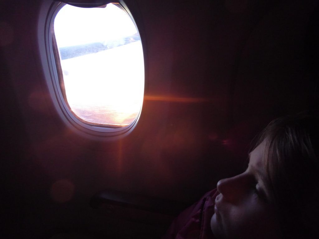 Child resting on a plane